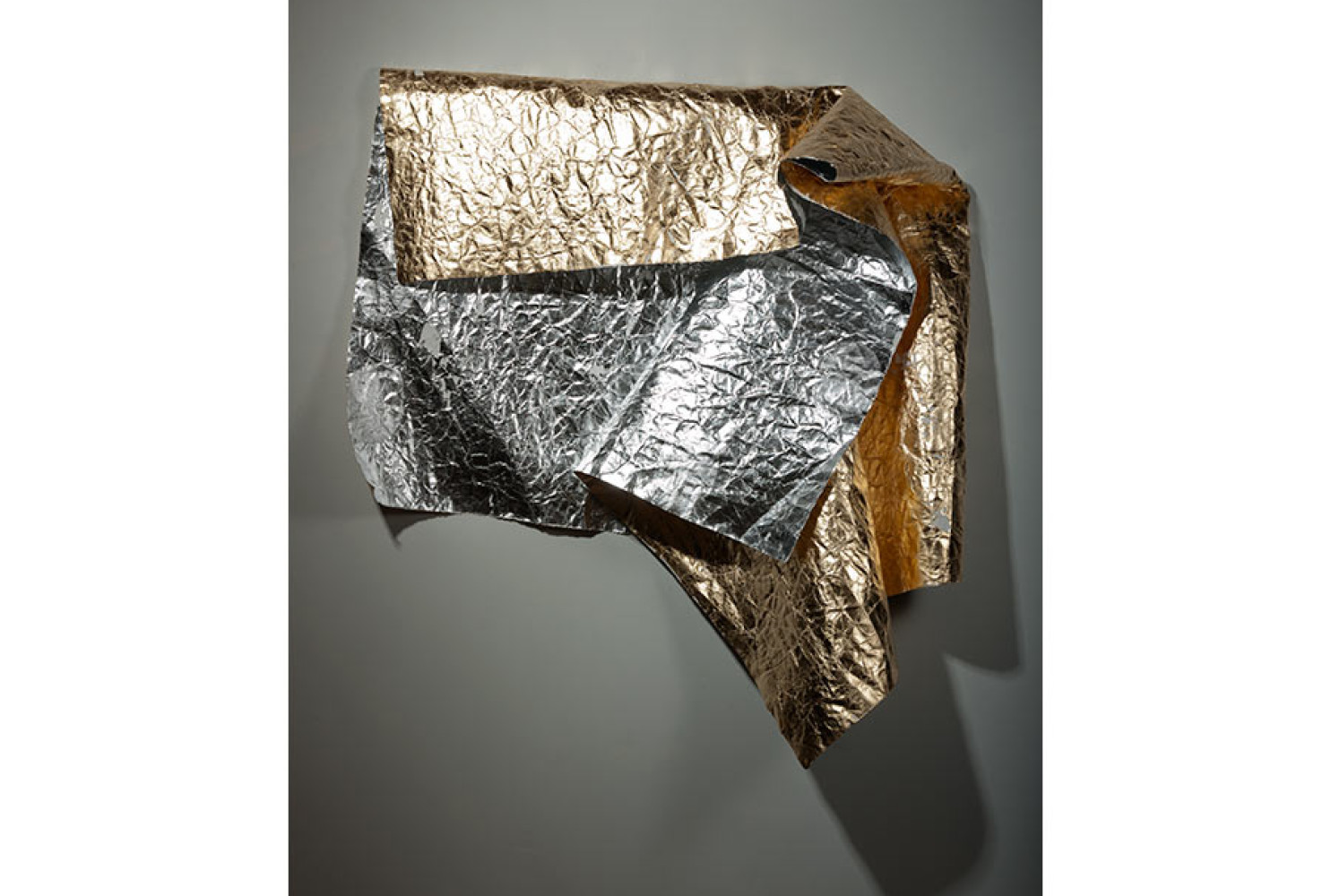 Damaged Emergency Blanked (for B. McQ.), 2015. Composition gold and aluminum leaf on distressed paper; 50 x 90 inches. Courtesy of the artist.