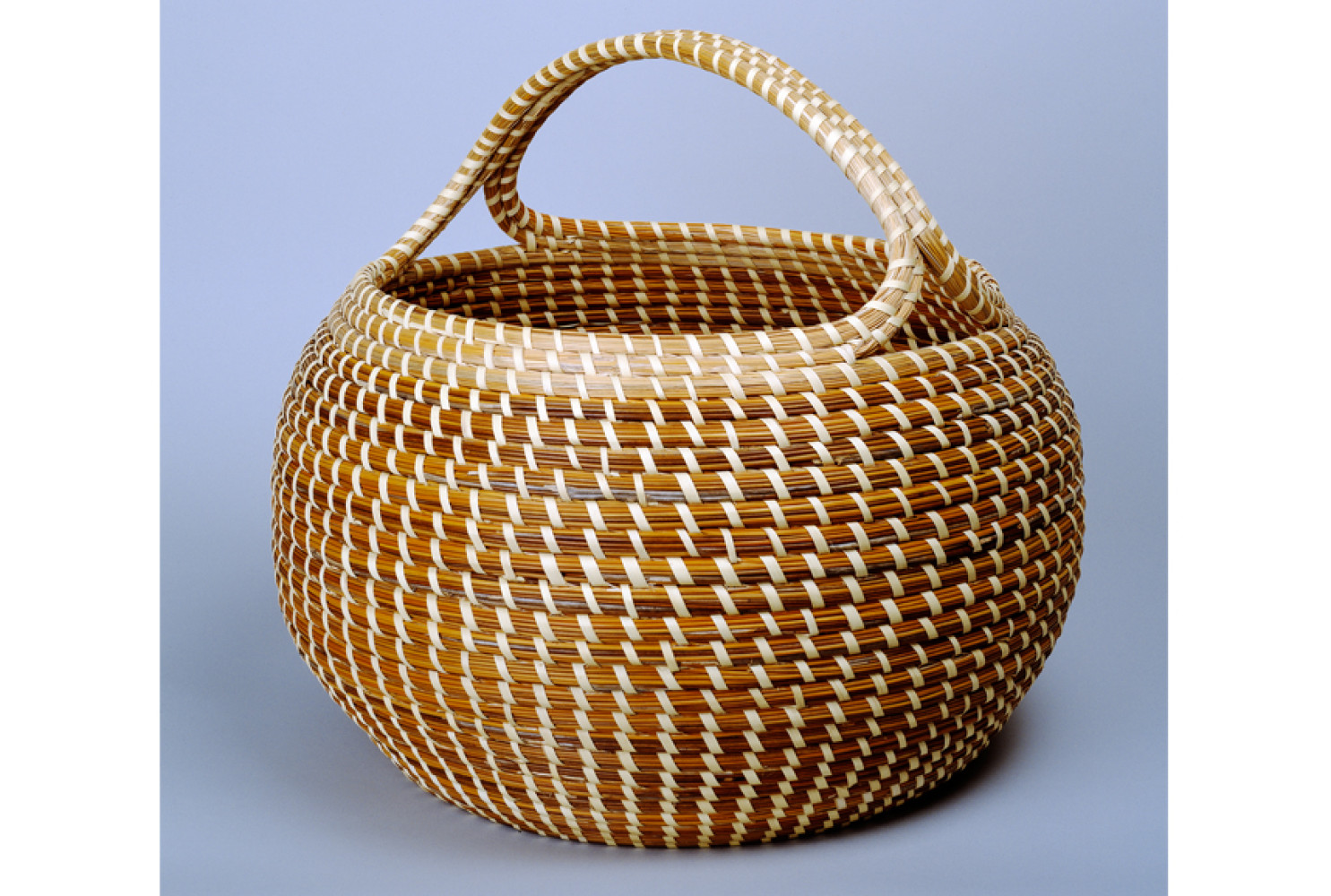 Cobra with Handle, ca. 1980, by Mary Jackson (American, b. 1945); sweetgrass, bulrush, palmetto, and pine needles; 15 x 16 inches; Museum purchase with funds donated by Mr. Robert Marks; 1984.026