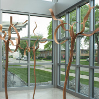 Undone, 2012,by Crowell A Pate IV; Black walnut, White oak, Cement; 80 x 26 x 26 inches (avg.); Courtesy of the artist.