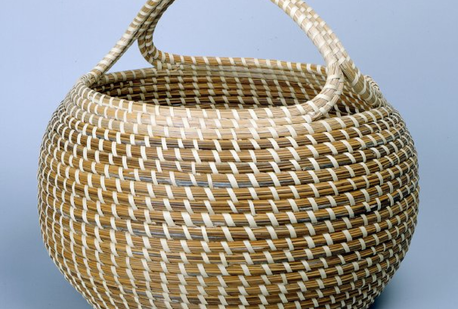 Cobra with Handle, ca. 1980, by Mary Jaskson (American, b. 1945); Sweetgrass, bullrush, palmetto; 15 x 16 in.; Gibbes Museum of Art, Museum Purchase with funds donated by Mr. Robert Marks (1984.026)
