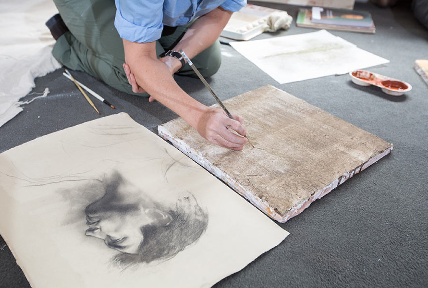 Jill Hooper transferring a drawing to a prepared fresco surface. 