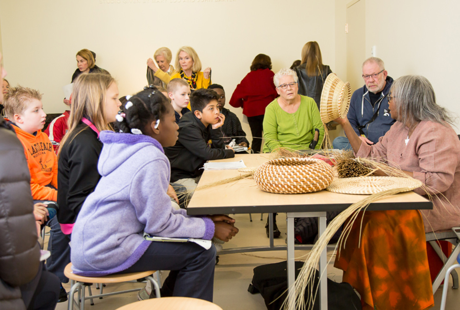Mary Jackson demonstrates her sweetgrass basket weaving techniques to students and Museum visitors. Image courtesy of MCG Photography. 