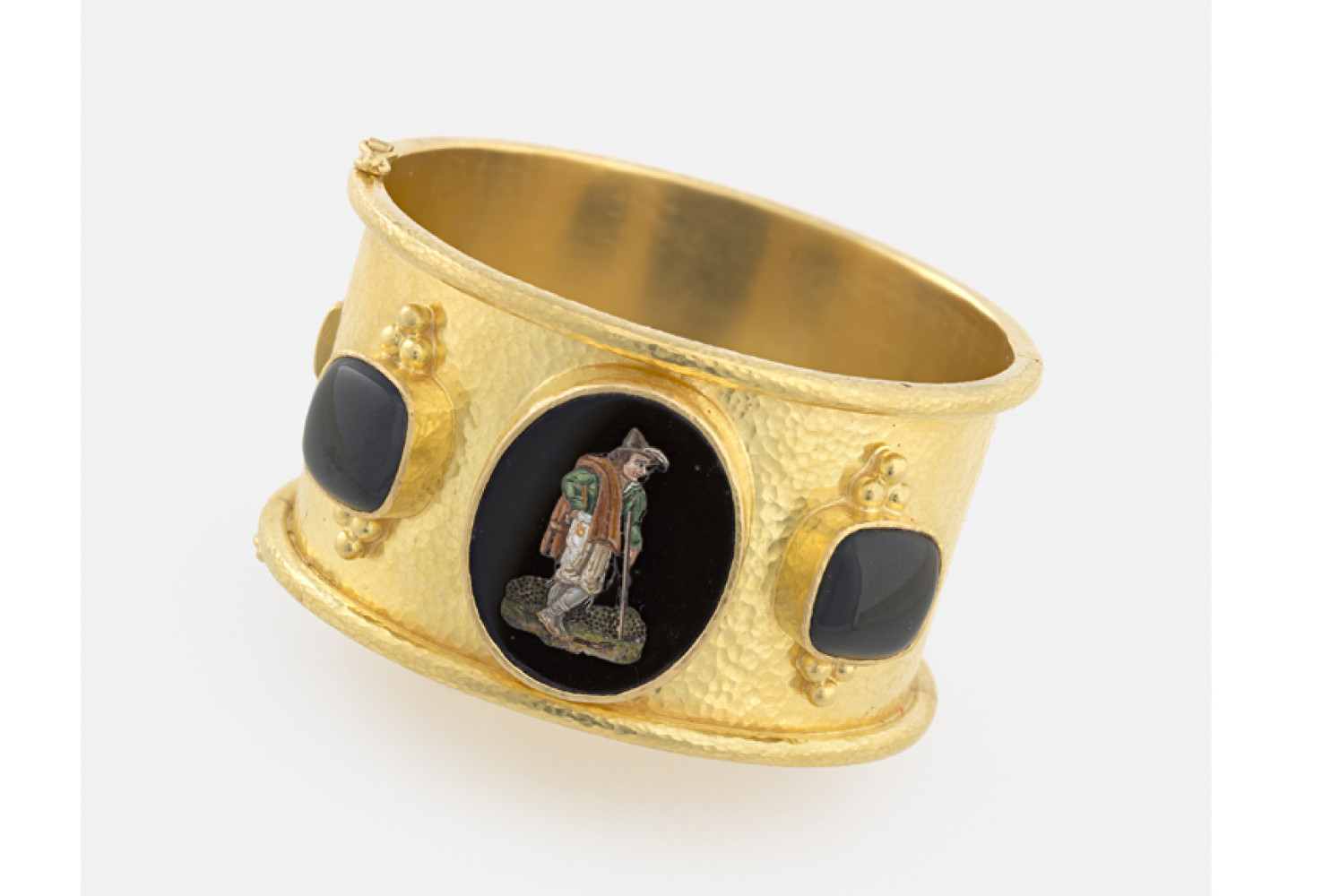 Peasant Man with Walking Stick, Rome, 19th century, after etchings by Bartolomeo Pinelli (Italian, 1781—1835); Micromosaic set in wide hammered gold bangle with rolled edges and side black jade cushions with gold triads, 1 3/8 x 2 1/2 x 2 3/8 in. Collection of Elizabeth Locke; Photo: Travis Fullerton; © Virginia Museum of Fine Arts

