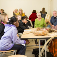 Mary Jackson demonstrates her sweetgrass basket weaving techniques to students and Museum visitors. Image courtesy of MCG Photography. 