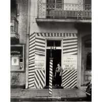 SIDEWALK AND SHOPFRONT,
NEW ORLEANS. FSA, 1935, by Walker Evans (American, 1903 – 1975). Silver print, 9 1/2 x 7 1/2 inches. Courtesy of the Collection Martin Z.  Margulies.