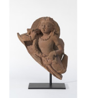 A vidyadhara (wisdom holder) or flying spirit; ca. 6th century; Fragment of a larger sandstone sculpture; India, Uttar Pradesh; Courtesy of a private collection