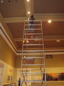Facility Manager/Preparator Greg Jenkins setting lights in the Main Gallery