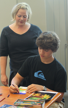 Anne Cimballa working with a student
