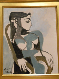 <em>Femme dans un fauteuil</em>, 1956, by Pablo Picasso (Spanish, 1881 – 1973). Oil on canvas; 39 ½ x 31 ½ in. Courtesy of Esther and James Ferguson. 