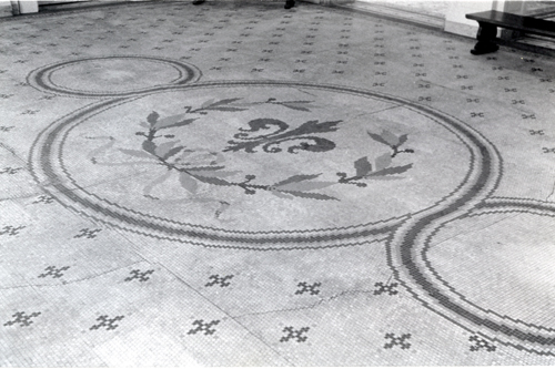 The roundel pattern in the tessera tile floor of the Rotunda gallery.