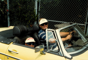 My sister Angie and my dad in his MG, 1981.