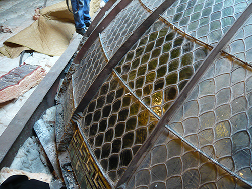 A section of the glass dome that has been cleaned.