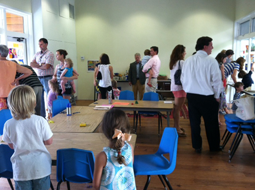 Parents and campers enjoy an art show at week's end.