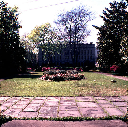 A view of the courtyard, ca. 1960s, with the Charleston Library Society in the distance.