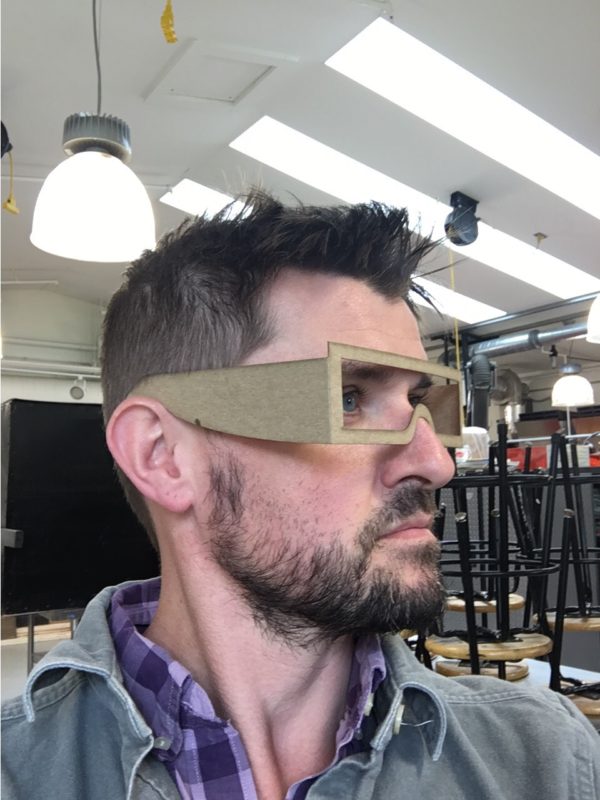 Artist Michael Zebrowski models a prototype of the Observer eclipse viewing glasses.