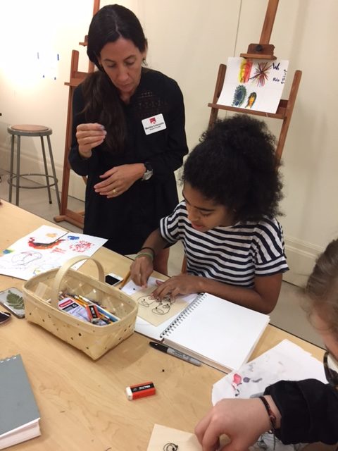 Teaching artist Martha Criscuolo works with campers. 