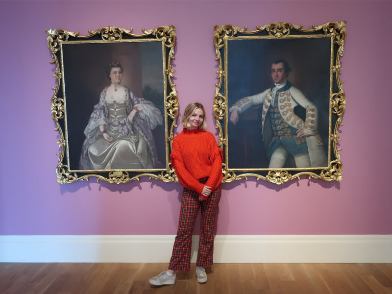 Gibbes Education Intern Brittany Marino poses in the main gallery. Brittany loves sharing her passion for the arts with the many students who visit the Museum on field trips.