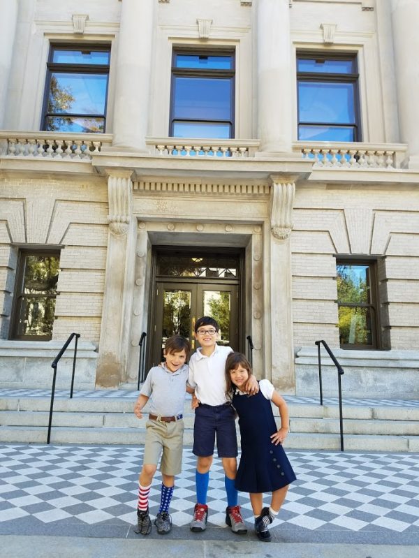 Courtney's three children pose in front of the Gibbes. When they're not visiting the Museum, they enjoy playing at nearby Waterfront Park.