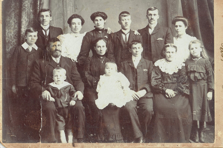 My grandfather, John Rimmington, is the second person from the left in the back row. His wife Emily is holding one of their 2 daughters, who came with Emily 5 months later.