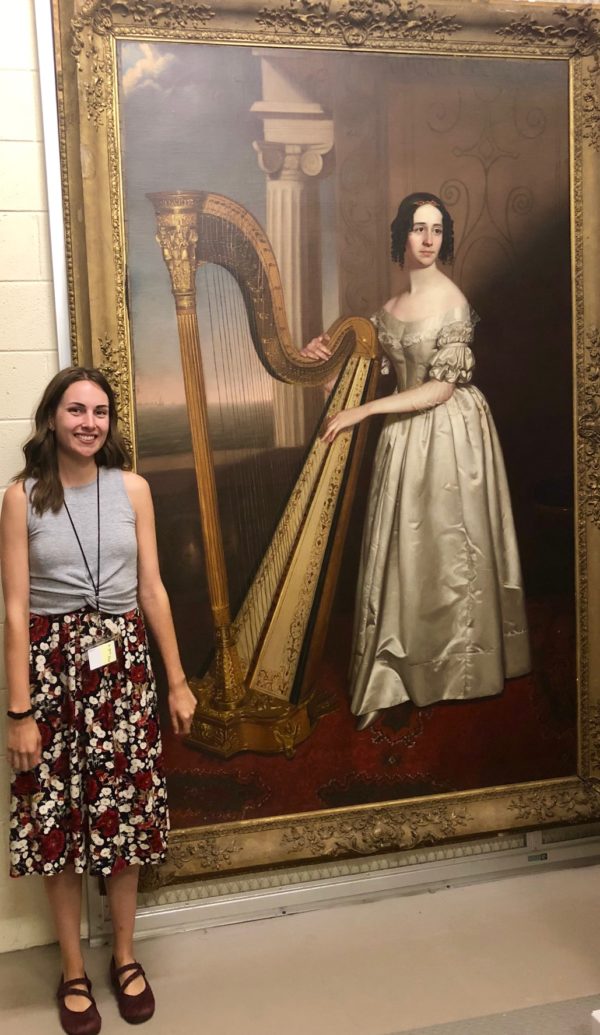 Here, Hannah stands excitedly in front of one of the Gibbes' largest paintings, which depicts Mrs. John Gibbes Shoolbred (Jane Ball) and her harp, an instrument that Hannah has played herself for twelve years! 